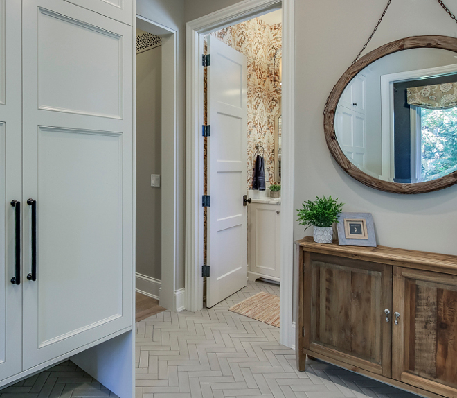 Herringbone Tile Mudroom and walls painted in Revere Pewter by Benjamin Moore