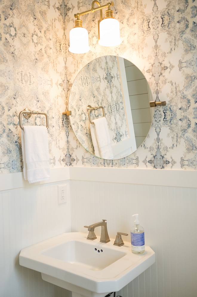 Powder bath with beadboard wainscotting and wallpaper above beadboard wainscoting wallpaper above wainscoting is Anthropologie source on Home Bunch