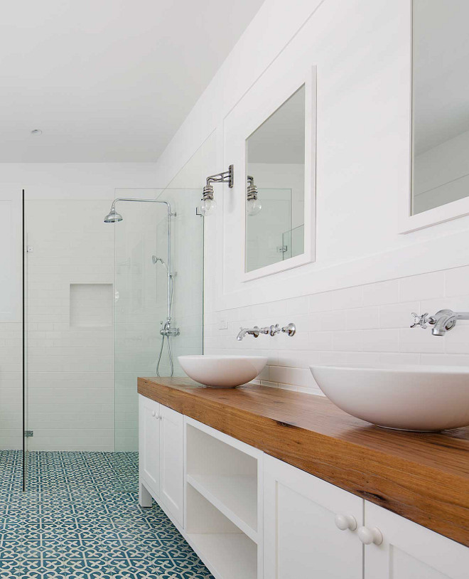 Modern Farmhouse Bathroom with thick butcher block countertop, vessel sinks, wall mounted faucets, curbless shower with patterned floor tile #modernfarmhousebathroom #bathroom