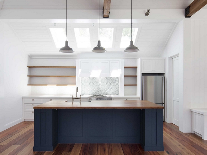 Kitchen skylight Kitchen features three skylights and hand-painted backsplash tile, Duquesa Tile by Walker Zanger, Coastal farmhouse kitchen with skylights shiplap ceilinh and beams