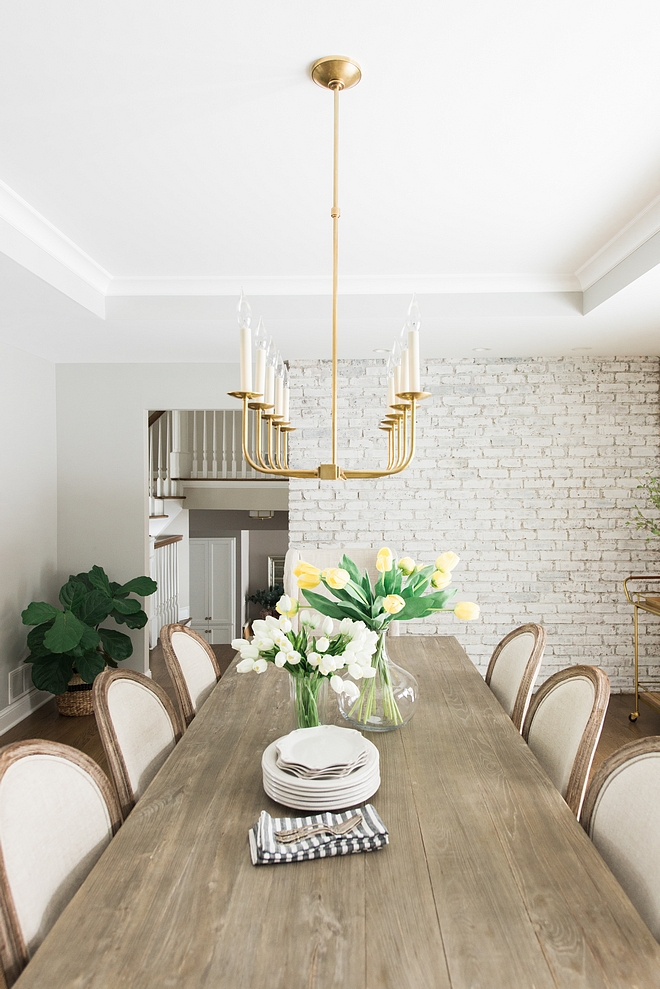 Modern Farmhouse Dining Table I love the natural, rustic feel of our dining table Modern Farmhouse Dining Table dining room with painted brick wall #ModernFarmhouse #DiningTable #paintedbrickwall