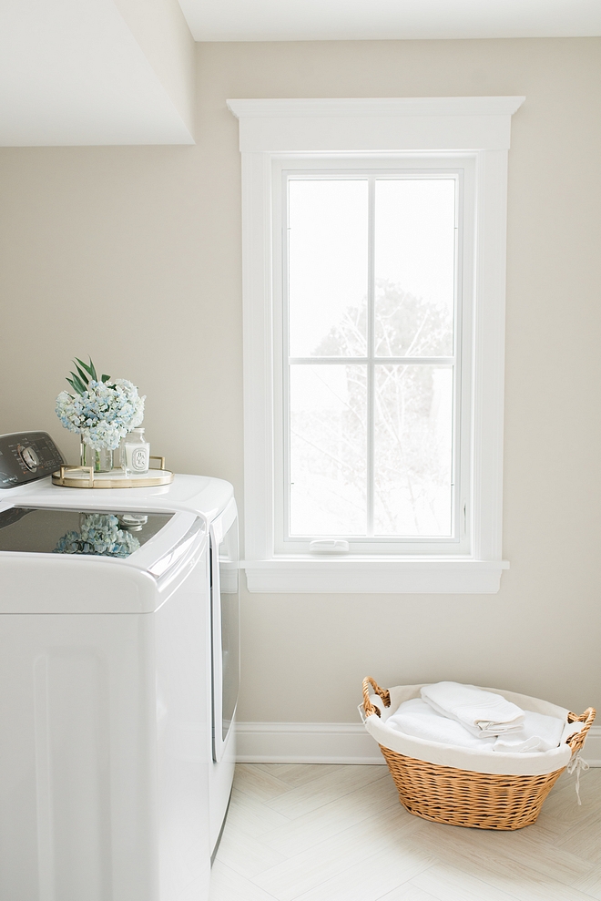 Benjamin Moore Sea Salt for this laundry room with wood looking floor tile in herringbone pattern Benjamin Moore Sea Salt Benjamin Moore Sea Salt #BenjaminMooreSeaSalt 