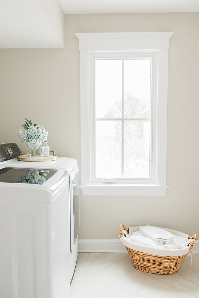 Benjamin Moore Sea Salt for this laundry room with wood looking floor tile in herringbone pattern Benjamin Moore Sea Salt Benjamin Moore Sea Salt #BenjaminMooreSeaSalt 