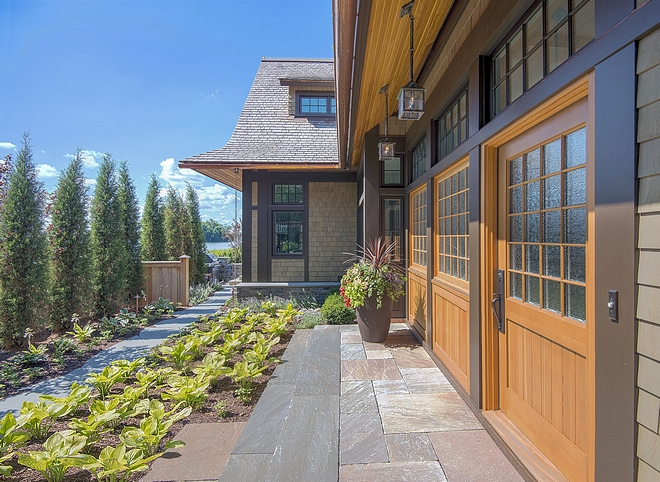 Lakehouse architecture design ideas When the garden is fully grown, the path will feel like a lush invitation to home and lake Deep eaves, cedar clear-finished soffits, and details like the rain chain suggest a subtle Asian influence