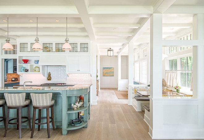 Open interior spaces with white millwork and white oak with a natural finish