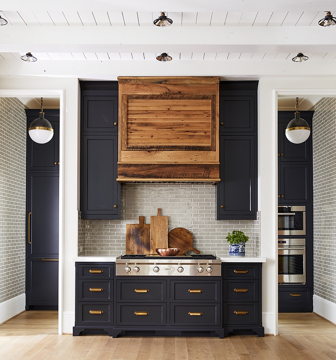 Kitchen Range Wall with Pantry Scullery on the back The fridge and the double ovens are just behind the main kitchen in the scullery You can see the paneled fridge to the left of the rangetop under the pendant and the ovens to the right #kitchen #rangewall #pantry