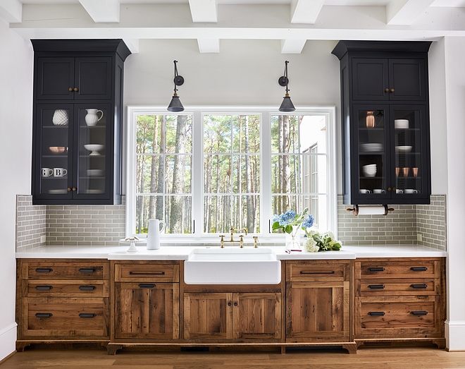 Two toned kitchen with reclaimed cabinets and blue black upper cabinets and grey crackle tile #twotonekitchen #reclaimedcabinet #reclaimedkitchencabinet #blackuppercabinet #crackletile 