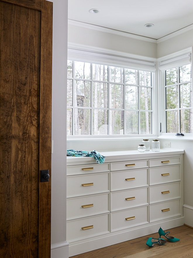 Master dressing room Built-in Dresser custom built, painted in custom color similar to Sherwin Williams Alabaster with brass pulls #builtindresser #dressingroom #SherwinWilliamsAlabaster