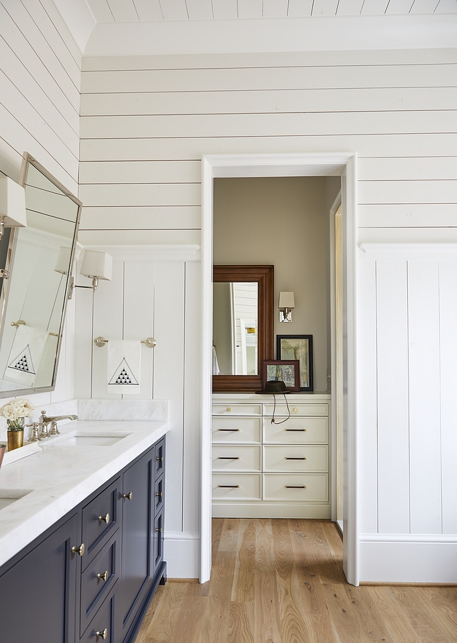 Shiplap Walls paint color Benjamin Moore PM- 20 China White with cabinets painted in Benjamin Moore Midnight Oil Bathroom features a combination of vertical and horizontal shiplap paneling #BenjaminMoore #paintcolors