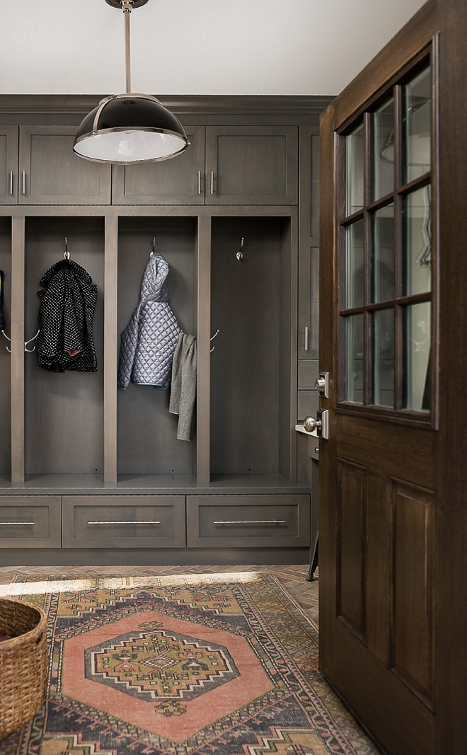 Farmhouse mudroom Farmhouse mudroom with vintage runner pendant light dark mudroom cabinetry mudroom lockers brick tile and wooden door farmhouse mudroom #farmhousemudroom #farmhouse #mudroom #vintagerunner