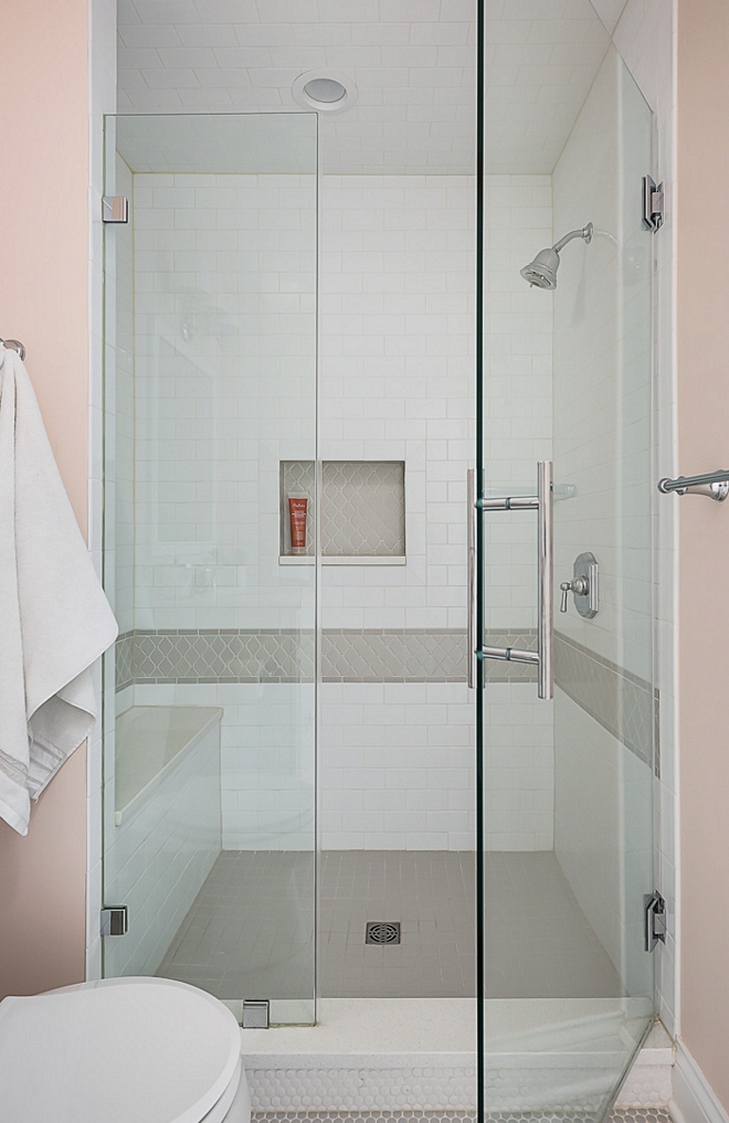 White and grey shower The shower features a classic combination of white and grey tiles Notice the shower bench with quartz slab on the left #showertile