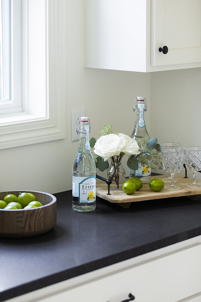 Butler's pantry features honed Opalescence Granite. Black granite looks great against white cabinetry