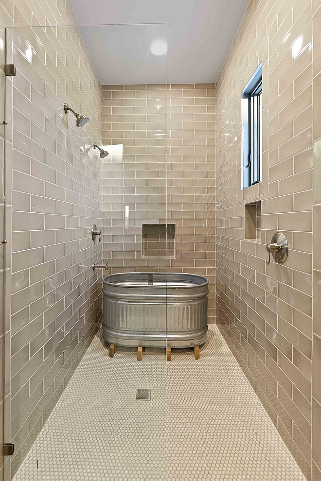 Farmhouse Bathroom Shower This farmhouse shower features a galvanized steel round end stock tank as a small bathtub #farmhouse #bathroom