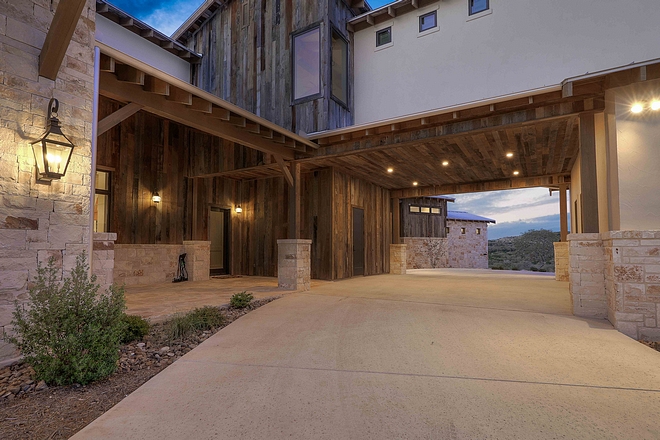 The porte-cochère features extensive use of reclaimed barnwood