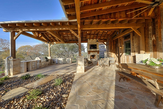 Outdoor Area with fireplace and outdoor kitchen