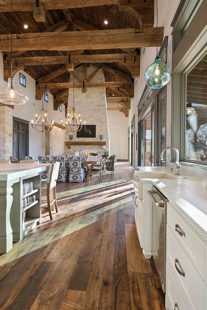 Kitchen with real reclaimed plank hardwood flooring barn wood shiplap ceiling and 100 year old timber beams and rafters #kitchen #reclaimed