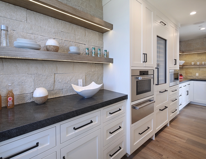 White kitchen paint color Benjamin Moore Cloud CC-40 with Stone backplash Stone is Pewter Veneer and Leathered Black Scozzese Granite countertop