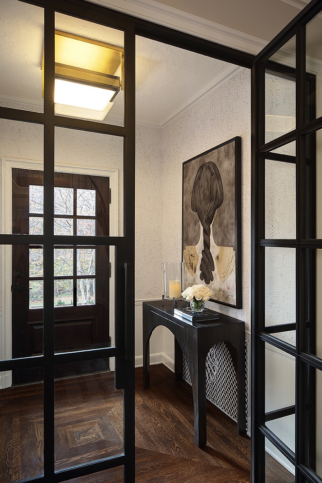 Foyer Black Steel Doors Custom black steel doors enclosures the foyer and brings a modern feel to this traditional home #blacksteeldoors