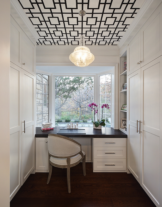 Pure White by Benjamin Moore Small home office with floor to ceiling built in cabinets and custom desk by window Paint color Pure White by Benjamin Moore #PureWhitebyBenjaminMoore #paintcolor #homeoffice