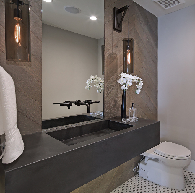 Chevron Shiplap Bathroom features custom cement sink and chevron shiplap walls