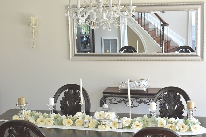 I wanted to keep this room simple so for the tablescape I used some faux florals from Michael’s to line the center of the table