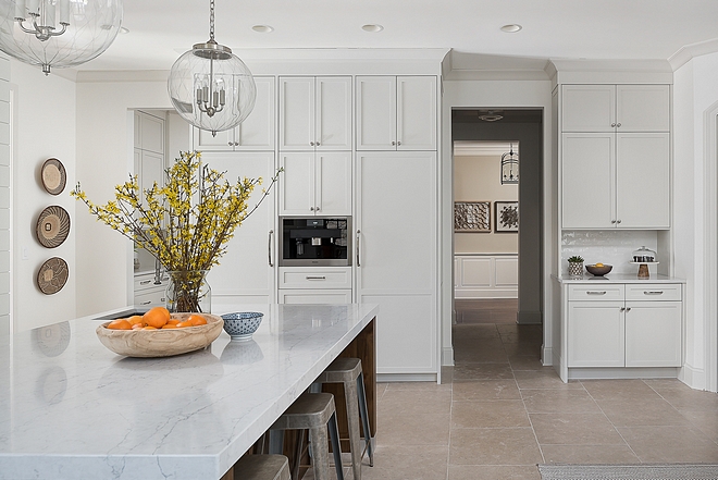 Classic Gray by Benjamin Moore Kitchen the cabinets are NOT white They are painted Benjamin Moore Classic Gray - this is my go-to color for creating the illusion of light and bright but with more warmth and depth The walls are Benjamin Moore White Dove