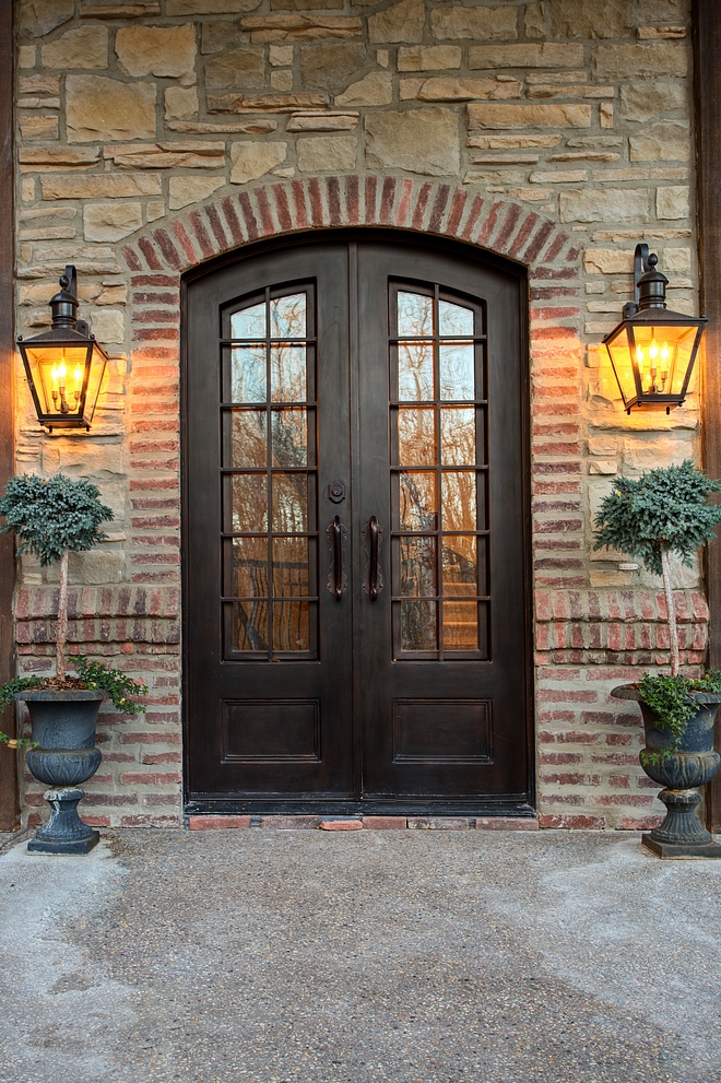 Iron and glass front doors with stone and brick accent Front doors custom in iron The doors are 8' tall and 5' wide #Irondoor #frontdoors 