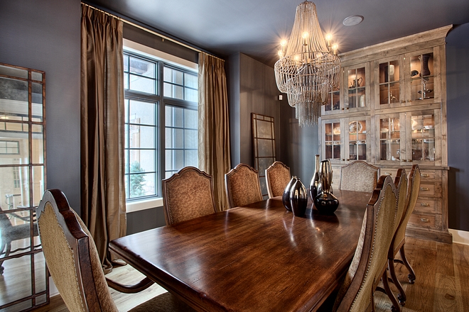 The dining room feels collected and inviting. It features a built-in hutch, black windows and 10' ceilings #Diningroom