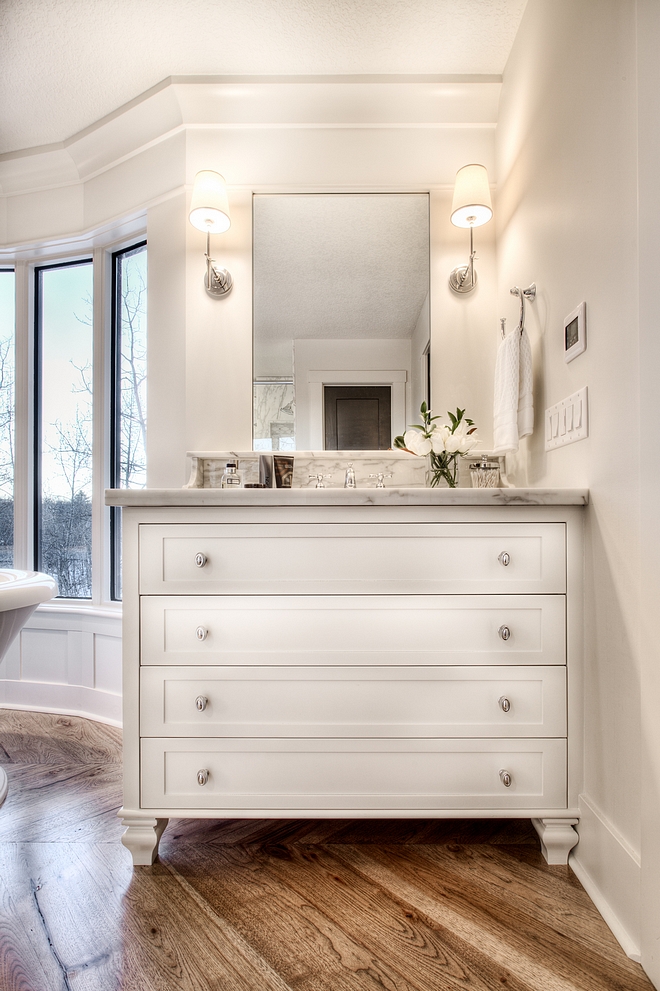 Bathroom vanities are painted in Benjamin Moore Oc-19 Seapearl