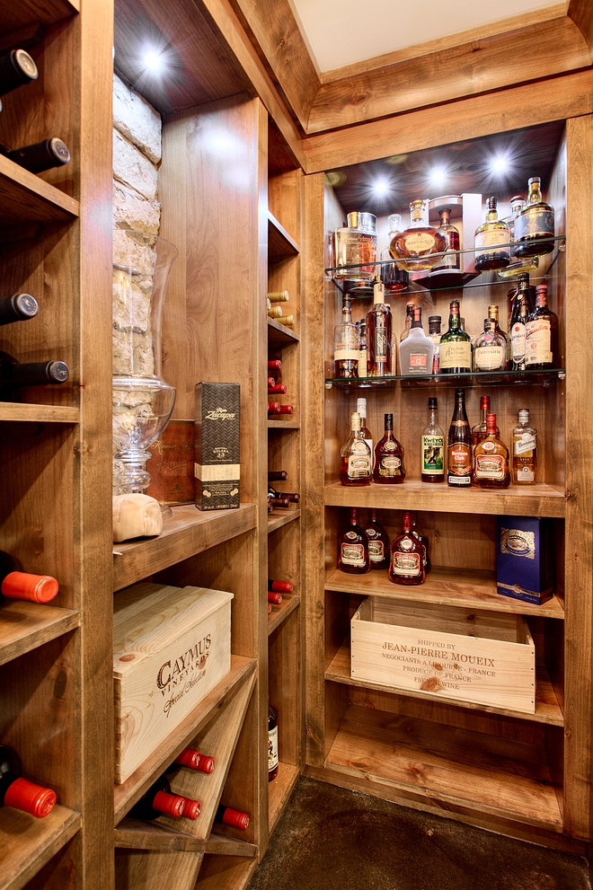 Bar shelves with exposed stone and Alder Cabinetry