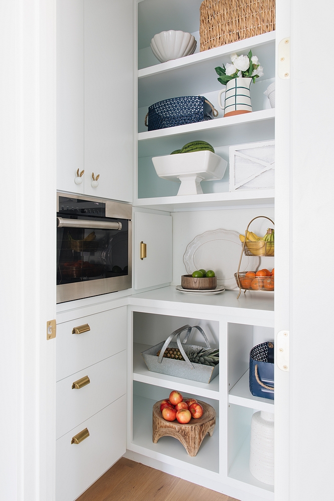 Pantry Kitchen pantry Pantry The pantry features steam oven, whimsy knobs and stylish containers of fruit and flowers #pantry #kitchenpantry