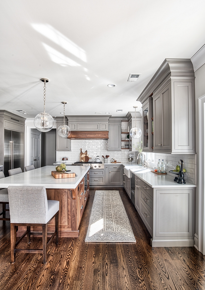 Trout Grey by Benjamin Moore 25% sheen The grey paint color on the cabinets is a custom mix. The cabinet markers worked loosely off of Trout Grey by Benjamin Moore for their starting reference #BenjaminMoore #Graycabinet #graykitchen #paintcolor