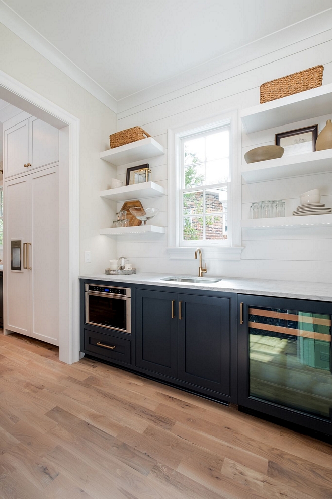 Butlers pantry Stunning butlers pantry Butler's Pantry features the open shelving for displaying fine china pieces, high priced alcohol, and accessories and is backed with shiplap accenting to create visual interest Custom shiplap wall with floating shelves #butlerspantry #shiplap #pantry #shiplapbacksplash #floatingshelves