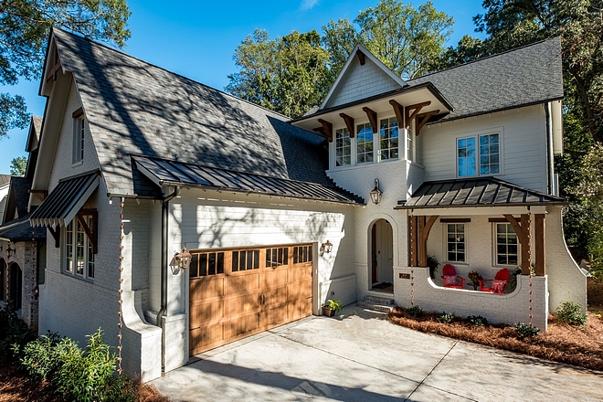 Brick Home exterior Brick front with side Cedar wood garage door stained and Rough Sawn Beam Accents all colors sourced on Home Bunch #brick #exterior #brickhome #paintedbrickhome