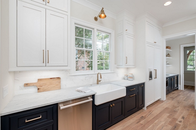 Kitchen Sink is a Kohler Farmhouse Apron Front sink in white Two toned kitchen with farmhouse sink and two toned pantry #kitchen #farmhousesink #twotonedkitchen