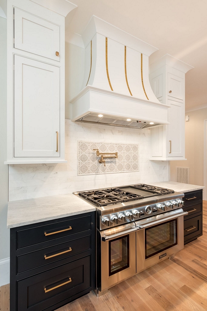The colors on the cabinets are custom but they're similar to Benjamin Moore Soot (lower cabinets) and Benjamin Moore Decorator's White (upper cabinets)
