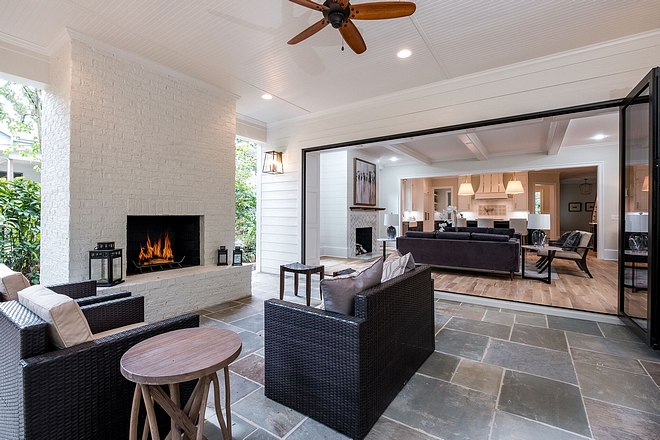 Patio with Painted Brick Fireplace The painted brick fireplace was a must and we made sure it had a grand presence by designing it to be 6 feet wide The beadboard ceiling with recessed lighting, large brick fireplace, and bluestone flooring makes you feel like you are in a room, while being outside enjoying the weather