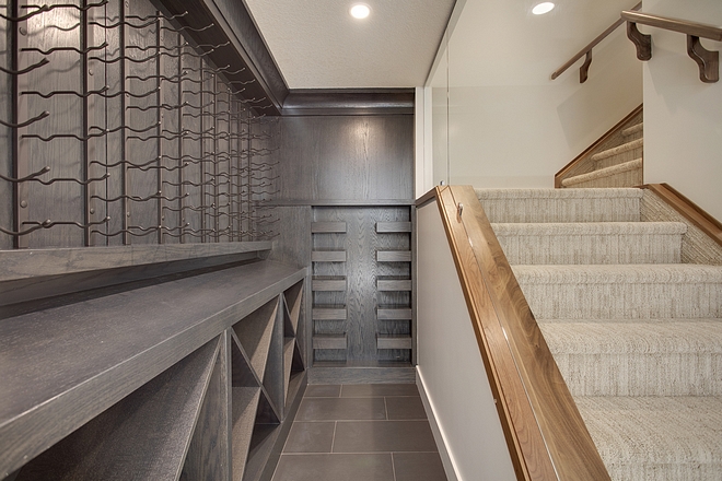 Long Wine Room with Dark Stained White Oak Cabinetry Basement Wine Room Wine Room Basement wine room Ideas #WineRoom