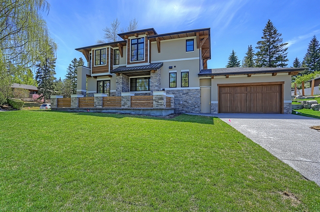 Side Garage The house features a side entry oversized attached garage with 8’ tall cedar stained garage door Side Garage #SideGarage