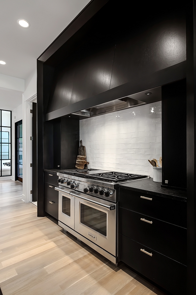 Black kitchen cabinet with white crackle subway tile Cotswold or Lancaster 3x6 white crackle subway tile #blakckitchen #whitecracklesubwaytile #cracklesubwaytile