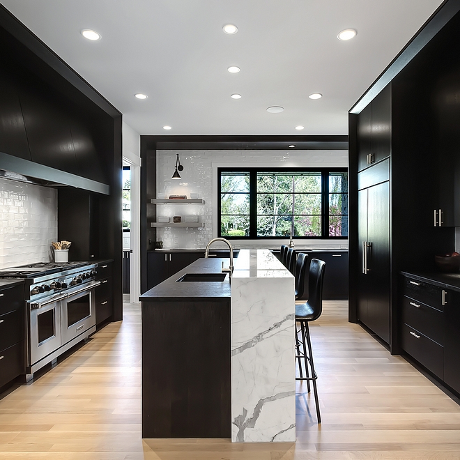 Raised Kitchen Island Raised marble counter in the kitchen is polished Statuario marble with mitered waterfall detailing #Raisedkitchenisland #kitchenisland #Statuariomarble #miteredwaterfall