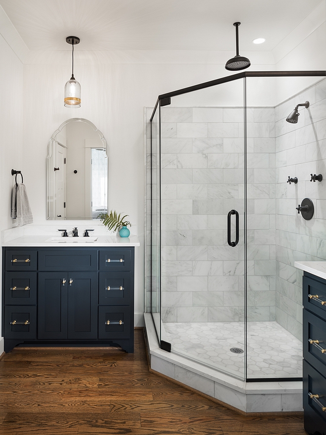 Farmhouse bathroom Farmhouse bathroom with black framed shower blue cabinets and hardwood flooring Farmhouse bathroom #Farmhousebathroom #bathroom #bluecabinet #bathroomhardwoodflooring #blackshower