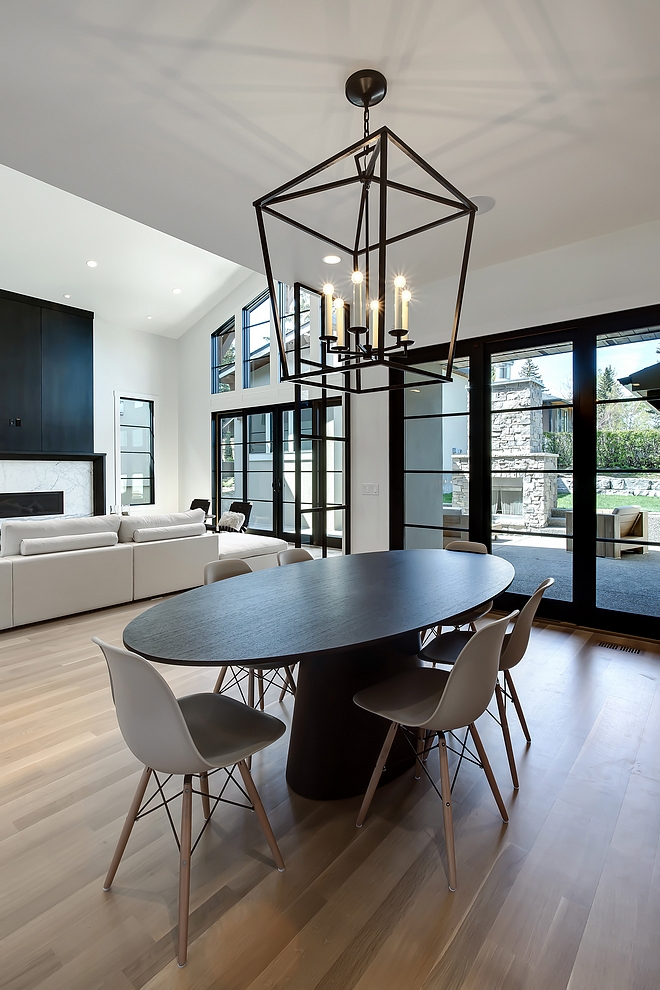 Modern farmhouse breakfast room with black steel patio doors and black pendant light #breakfastnook #pendantlight #blacklighting #blacksteel #patiodoor #steelpatiodoor #blackwindows #modernfarmhouse