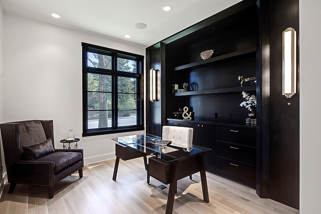 Black and white home office The home office features custom 1⁄4 sawn oak cabinetry Note the floor plug under desk Handy #homeoffice #blackandwhite #office
