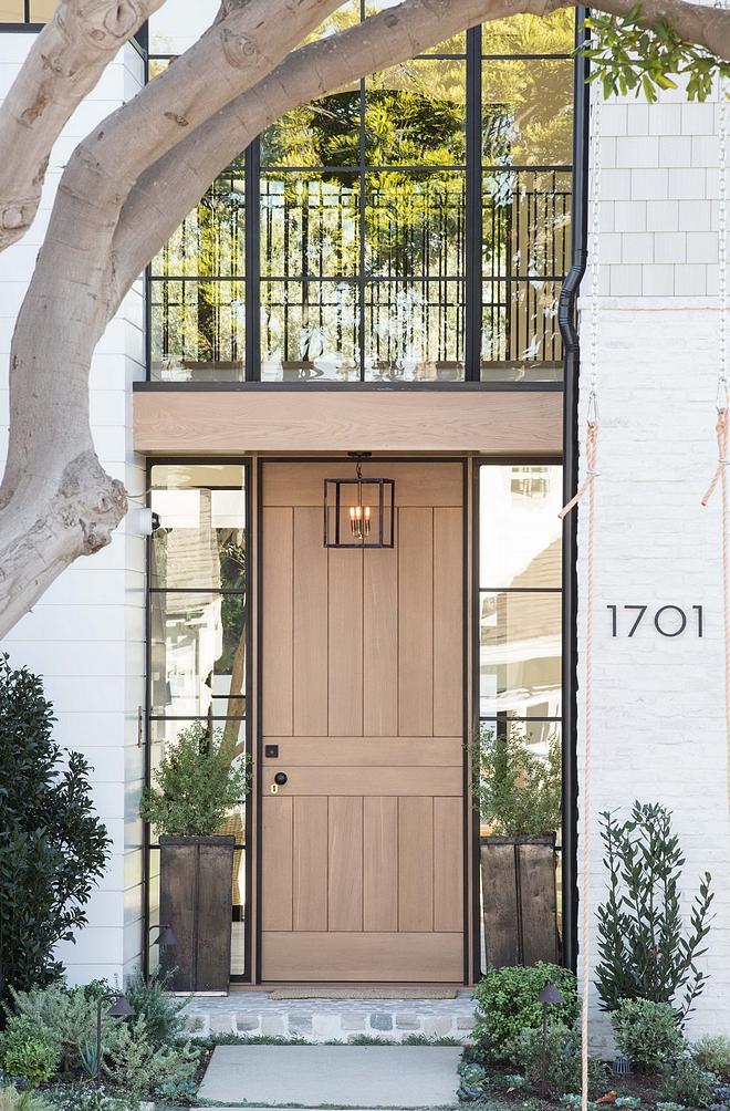 Front door is custom Rift Oak Dutch door Rift Oak Front Door with black windows Rift Oak Door Rift Oak Front Door #RiftOak #Frontdoor #Dutchdoor #door #blackwindows