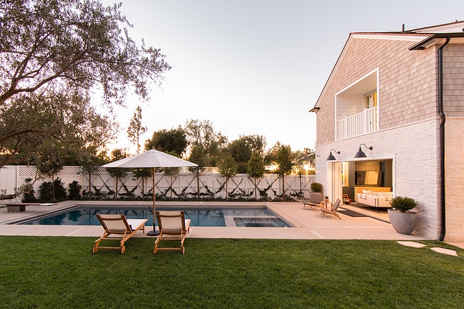 Beautiful Backyard with Pool and White Fence