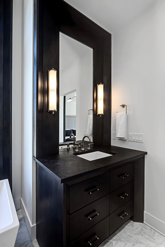 Bathroom features ‘His’ & ‘Hers’ custom 1⁄4 sawn oak vanities with granite vanity tops #bathroomvanity