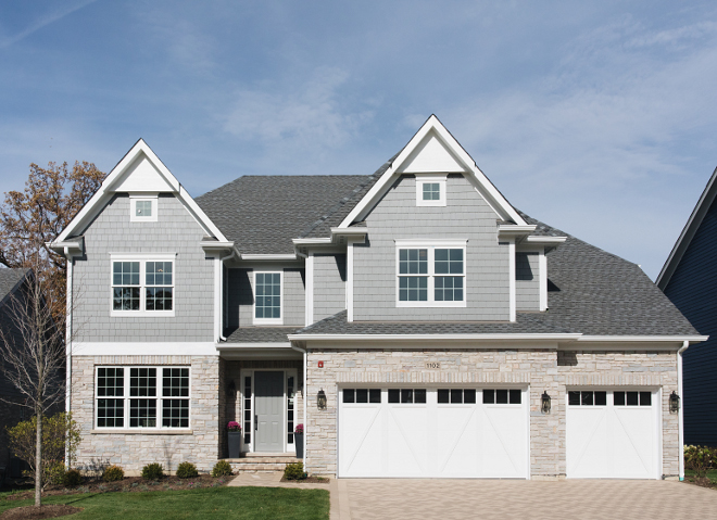 Siding and shakes are Hardie Grey Slate We color matched the front door to the Grey Slate Trim is Hardie Arctic White The stone is Blue River Select Gray The brick is Aztec White and the shingles are Aged Pewter #siding #greysiding