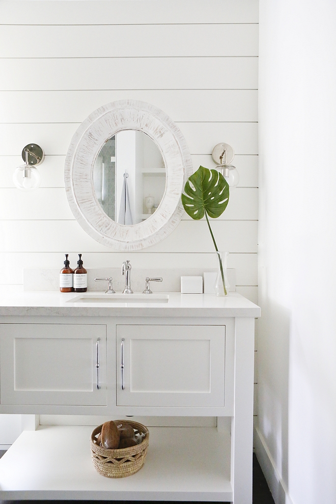 Bathroom Shiplap The bathroom has shiplap on the wall, Calacata Nuvo countertop by Caesarstone and a custom built vanity painted in Simply White by Benjamin Moore #bathroom #shiplap