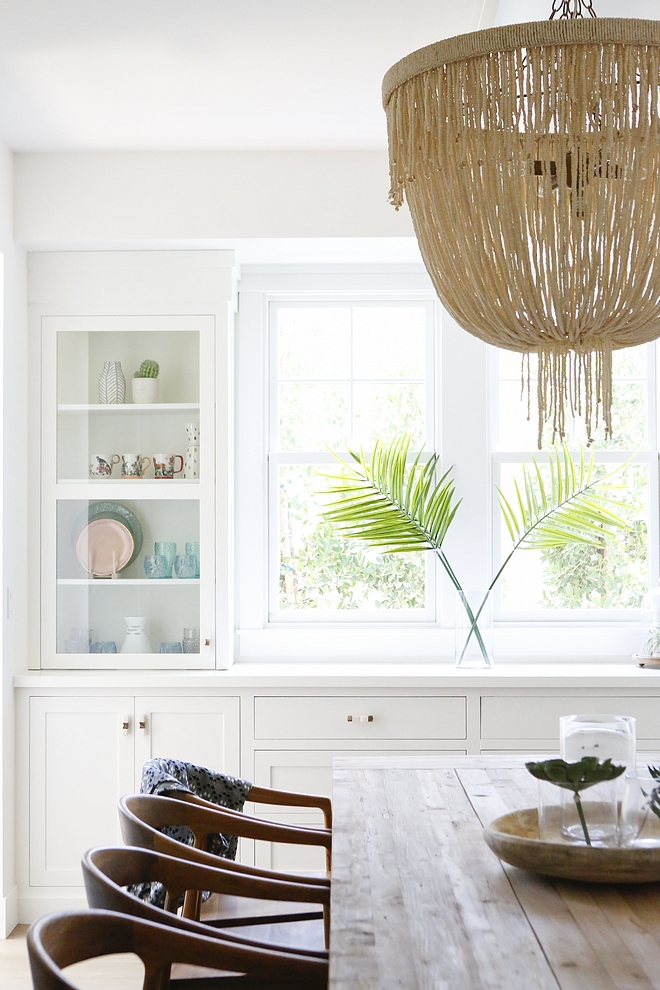 Coco bead chandelier We created a formal dining space but still wanted it to feel casual and warm for friends and family to gather and eat The dining table is a 10 foot salvaged wood farm table from Restoration Hardware with a large coco bead chandelier on top #cocobeadchandelier